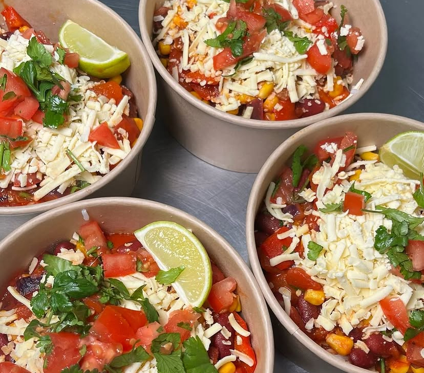 Fresh bowls with tomato, lime and herbs